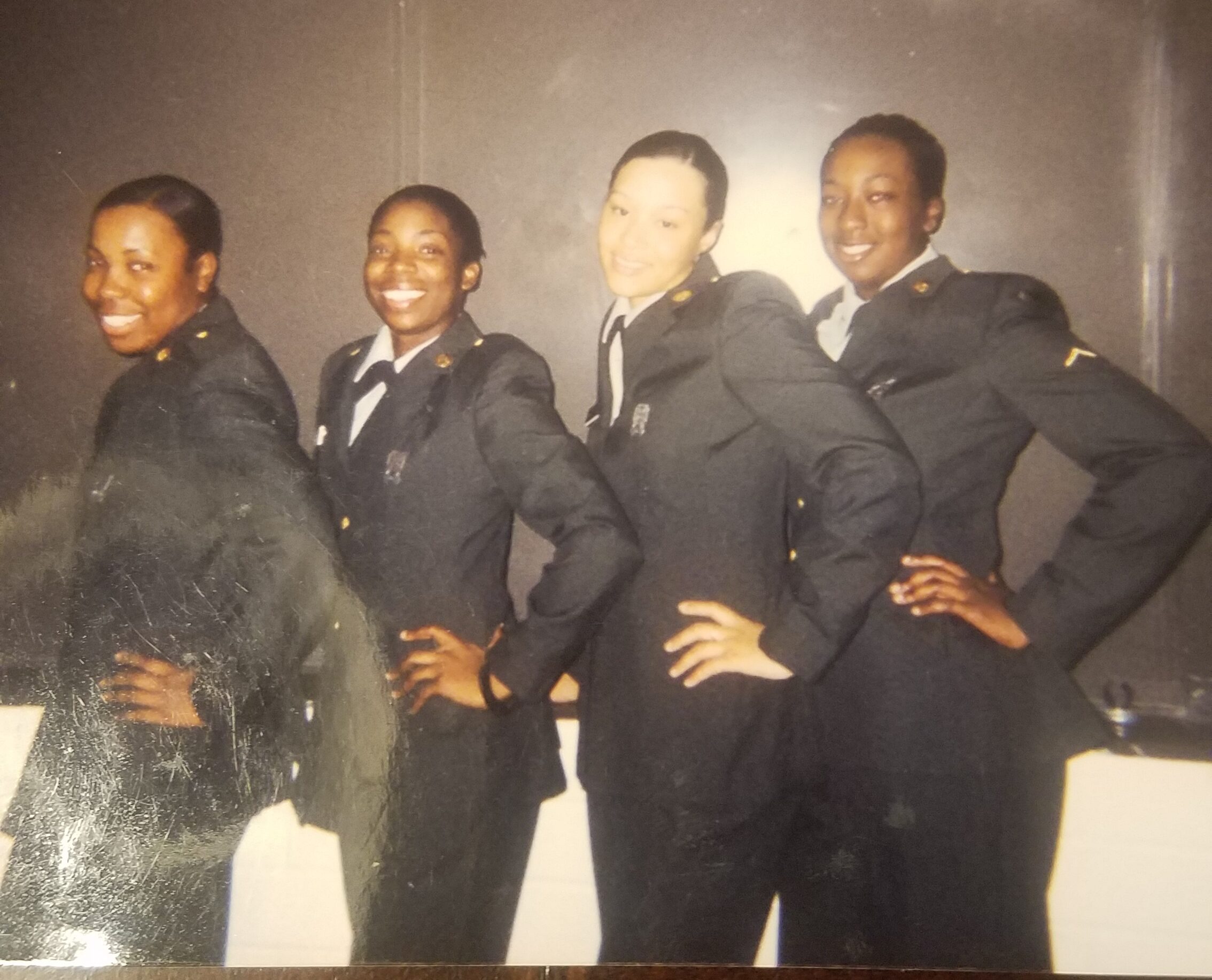 Deidra in the military with soldier friends
